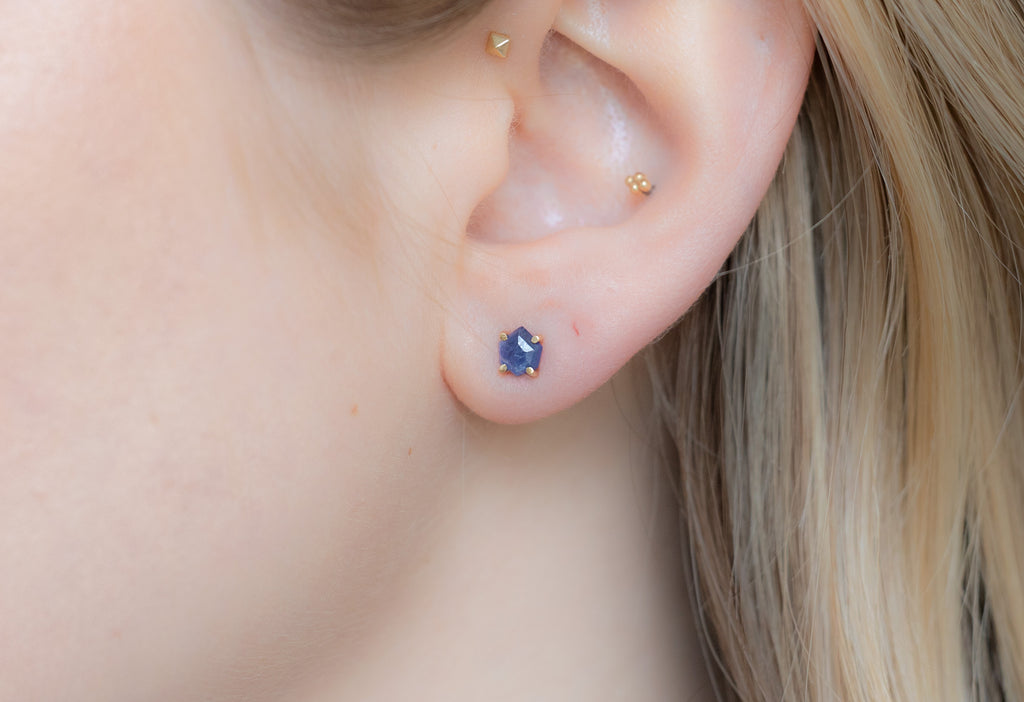 Natural Rose-Cut Blue Sapphire Hexagon Stud Earrings in Yellow Gold on Model