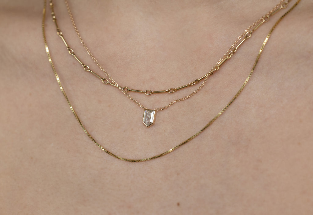 One of a Kind Custom Geometric White Diamond Necklace Layered on Model