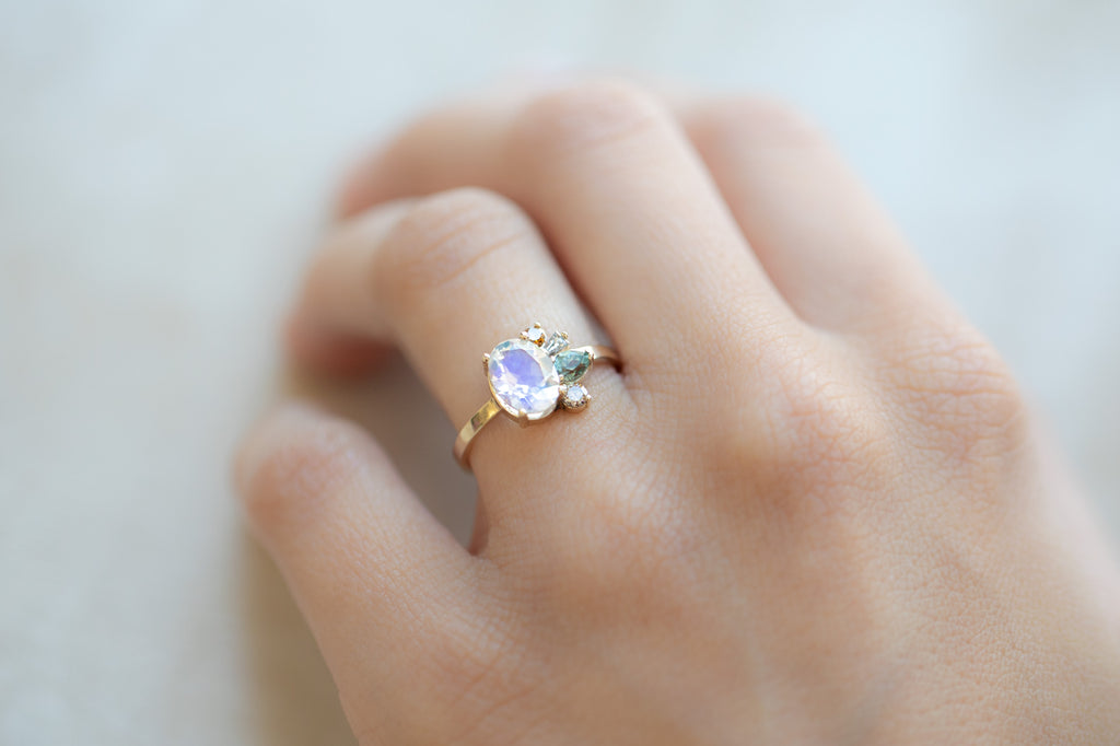 One of a Kind Moonstone and Diamond Cluster Ring on hand