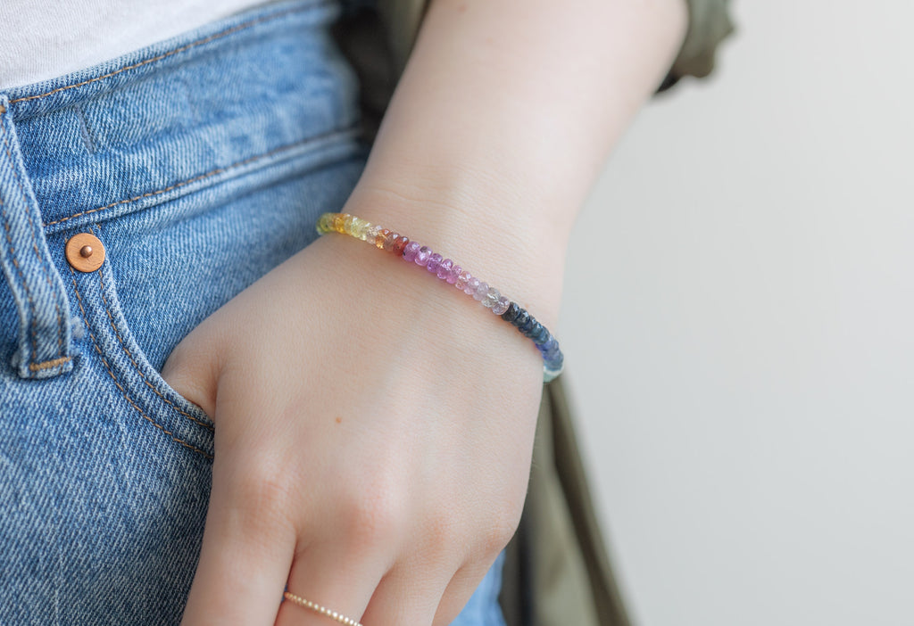 Rainbow Sapphire Beaded Bracelet on Model with hand in pocket