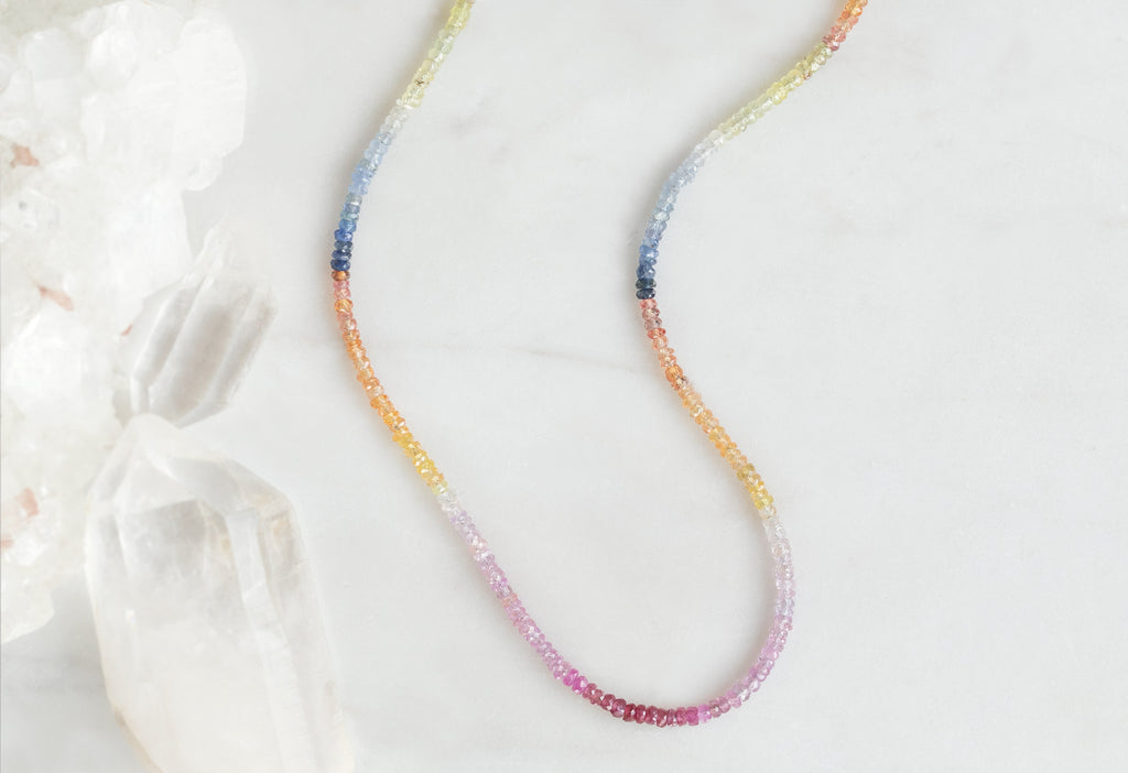 Rainbow Sapphire Beaded Necklace on Marble Tile