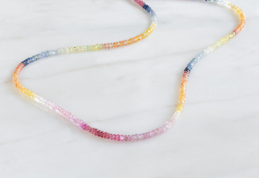Rainbow Sapphire Beaded Necklace on Marble Tile