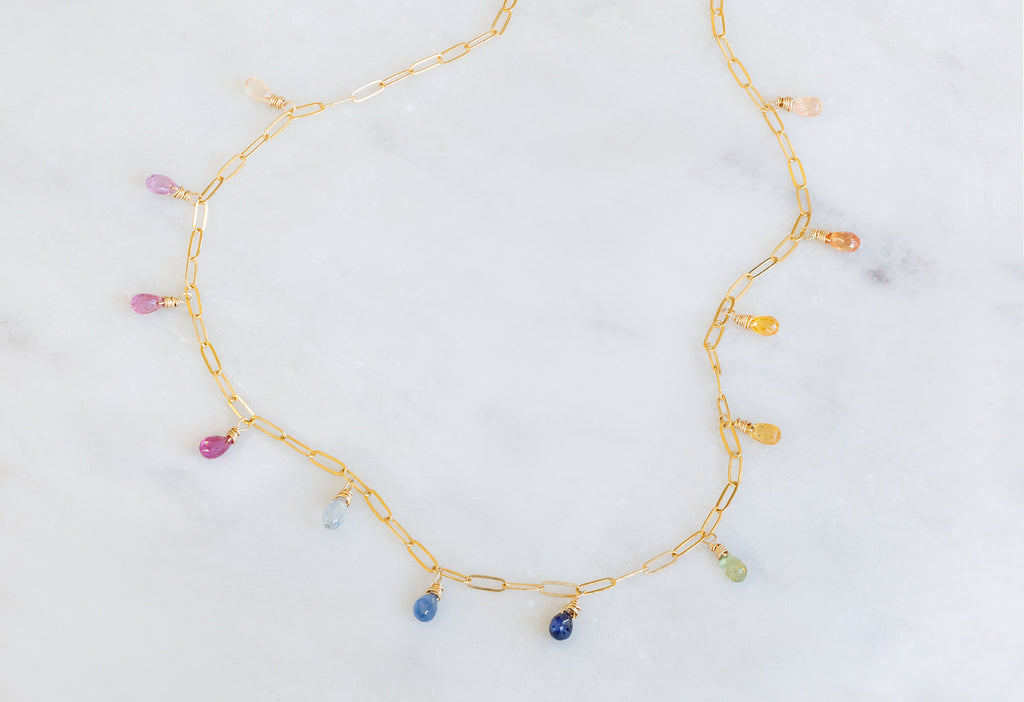 Rainbow Sapphire Briolette Necklace on Marble Tile