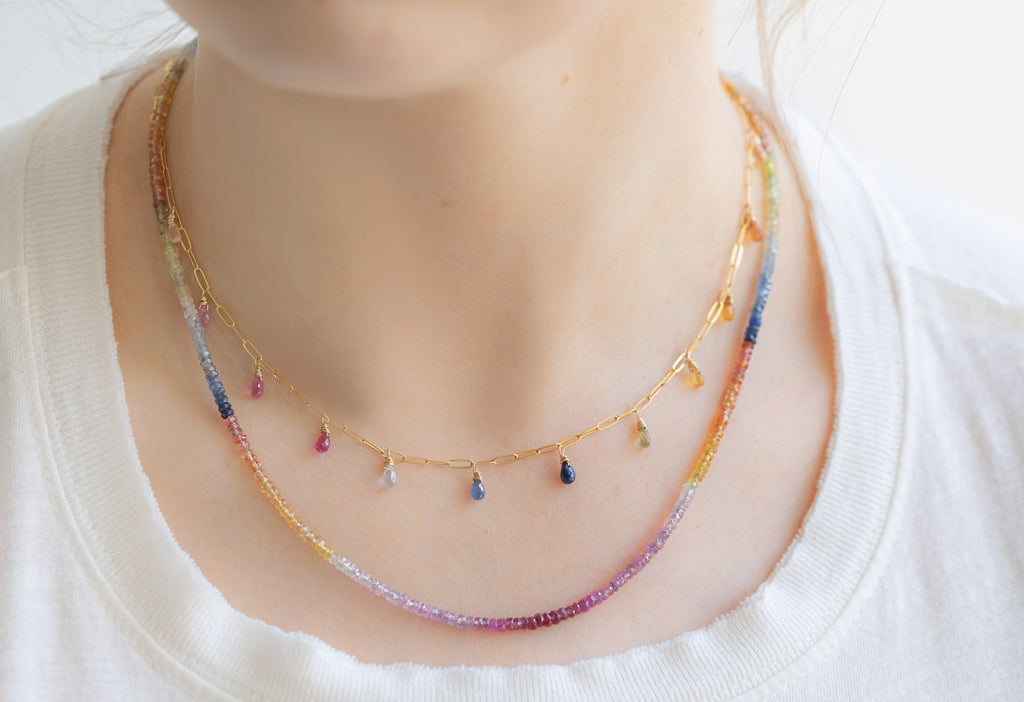 Rainbow Sapphire Briolette Necklace Layered with Rainbow Sapphire Beaded Necklace on Model