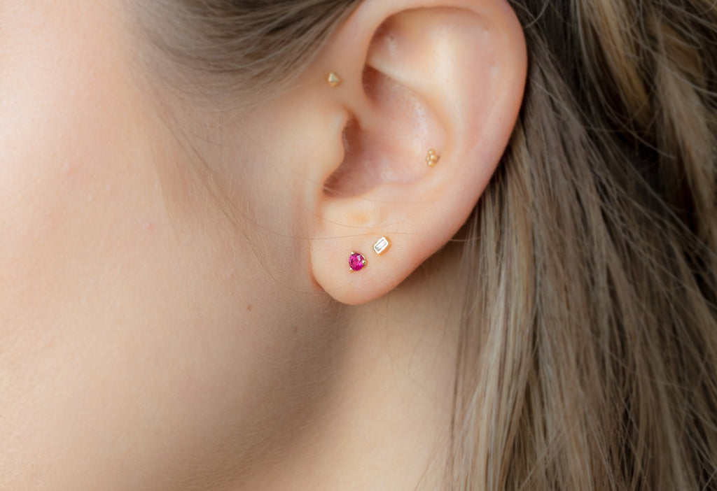 Round-Cut Ruby Stud Earrings Stacked on Model