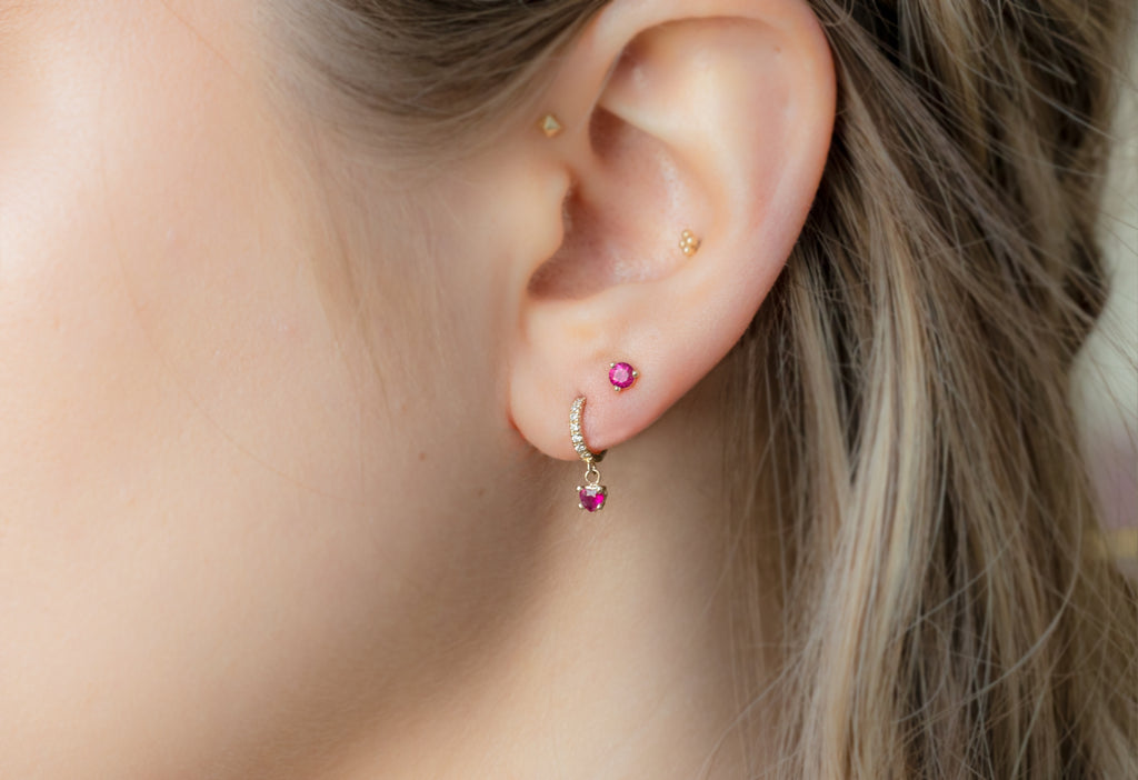 Round-Cut Ruby Stud Earrings Stacked on Model