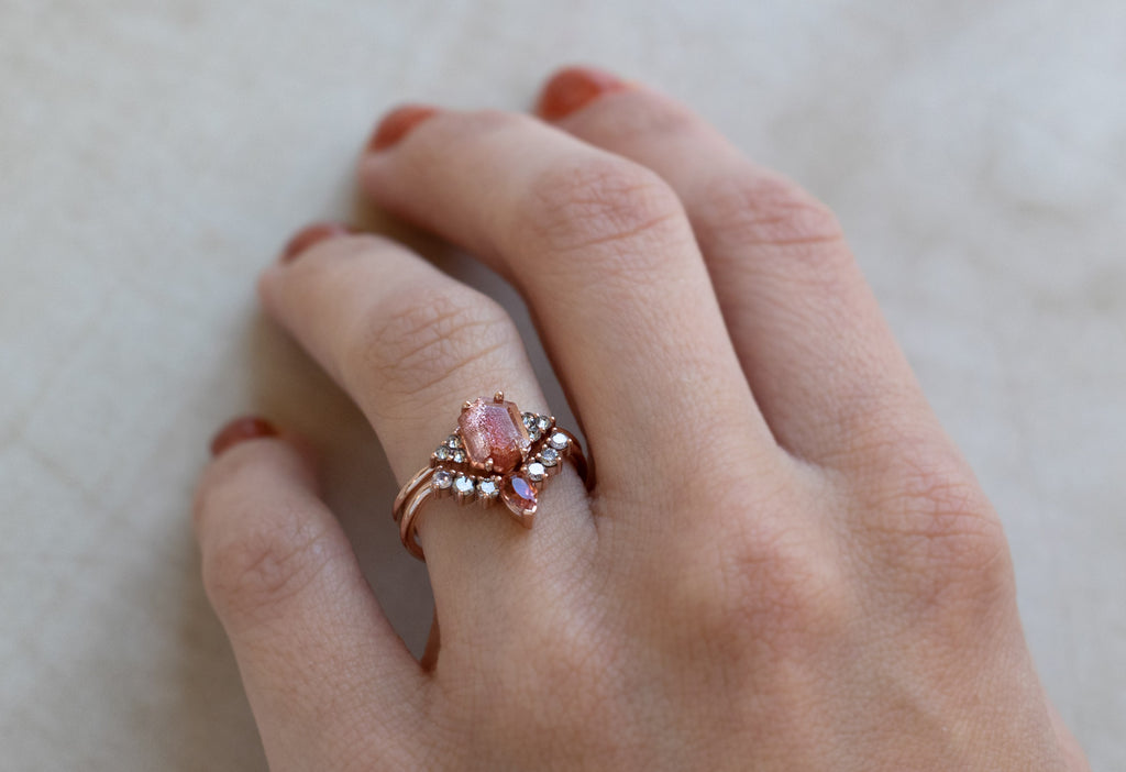 Sunstone + Pink Diamond Sunburst Stacking Ring Stacked with Engagement Ring on Model