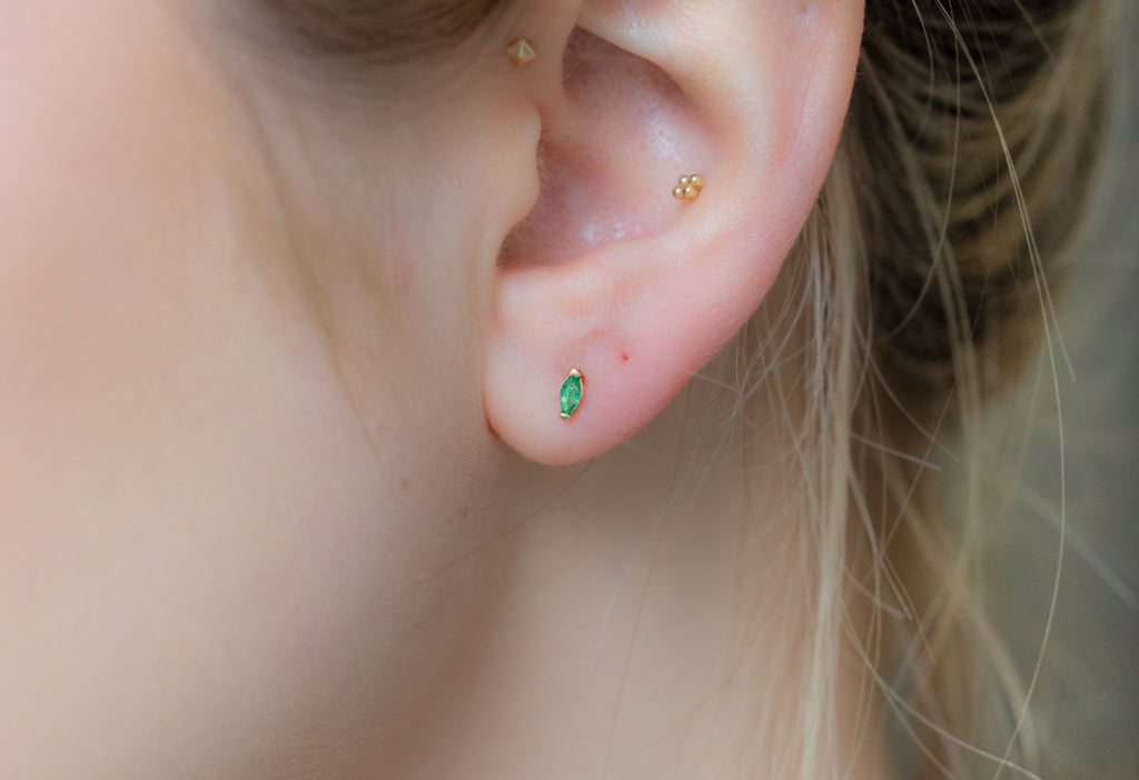 Teensy Emerald Stud Earrings on Model