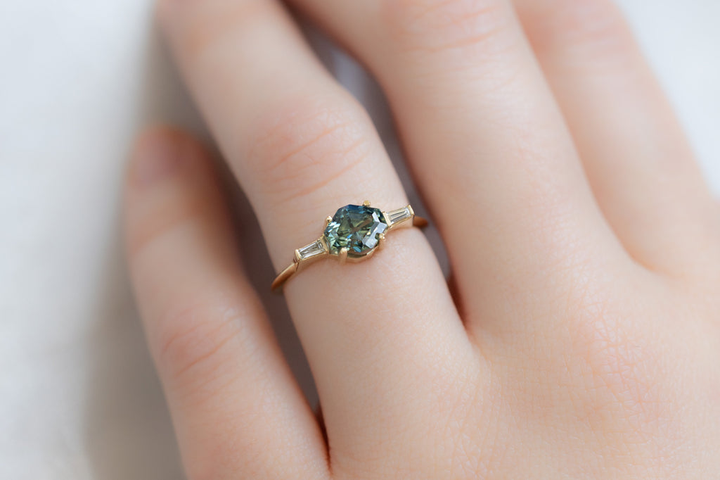The Ash Ring with a Artisan-Cut Bicolor Sapphire on Model