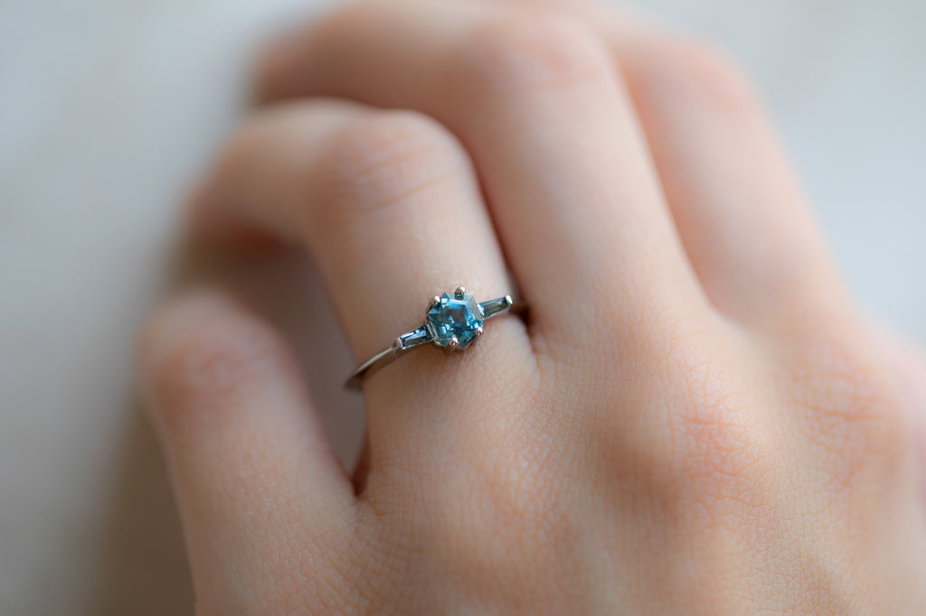 The Ash Ring with a Montana Sapphire Hexagon on model