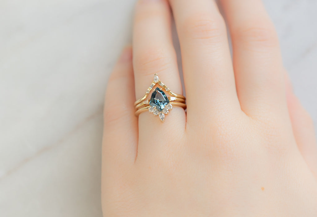 The Aster Ring with a Geometric Sapphire with White Diamond Stacking Bands on Model
