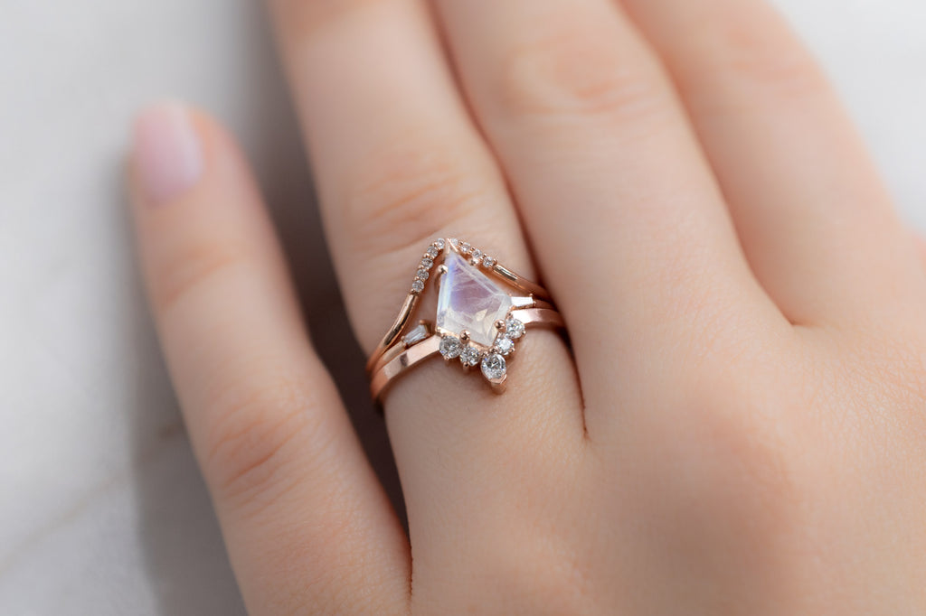 The Aster Ring with a Kite Shaped Moonstone with White Diamond Stacking Bands on Model