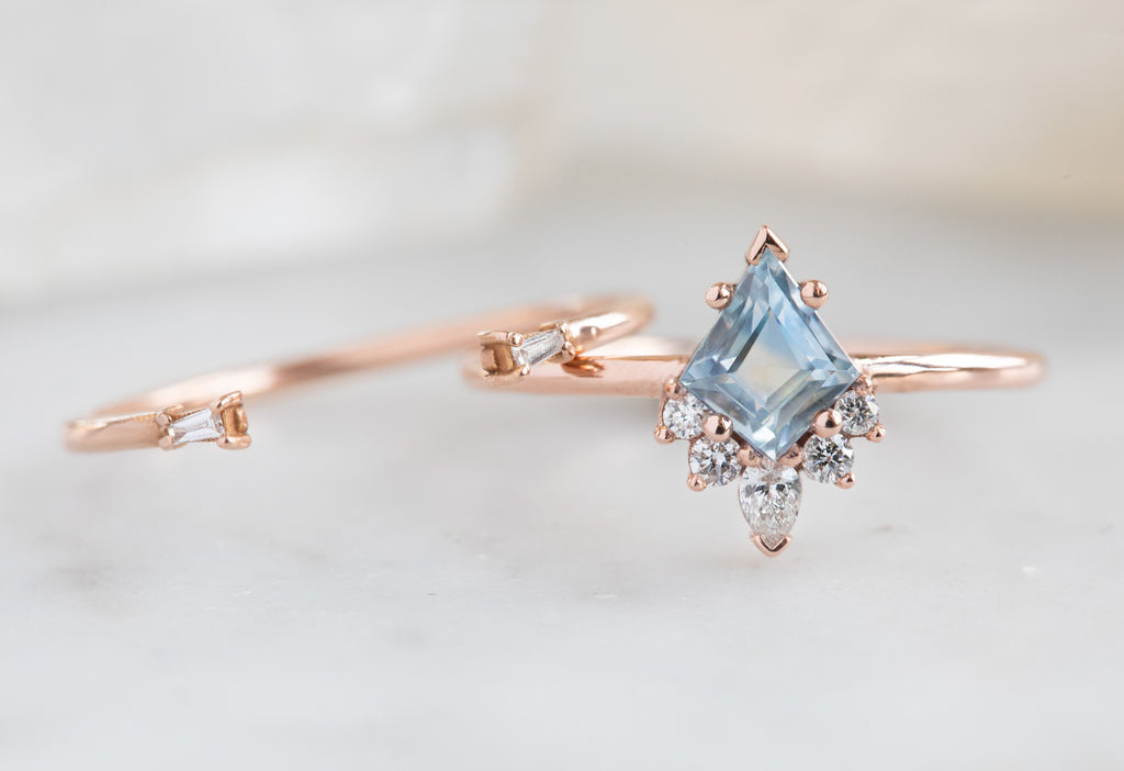The Aster Ring with a Kite-Shaped Pastel Sapphire with Open Cuff Baguette Stacking Band