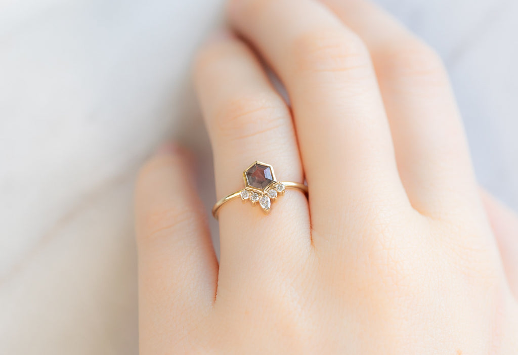 The Aster Ring with a Mauve Sapphire on Model