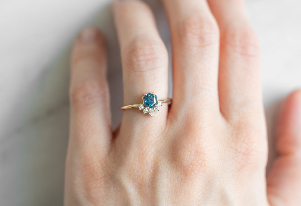 The Aster Ring with a Montana Sapphire Hexagon on Model