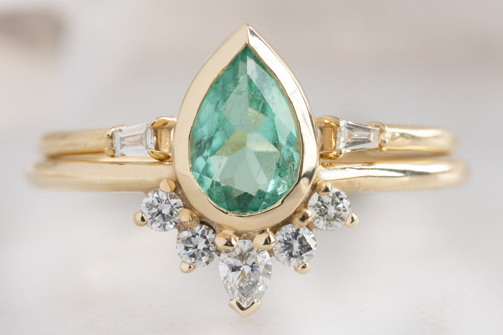 The Aster Ring with a Pear-Cut Emerald with Stacking Band