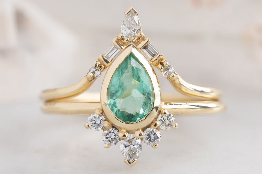 The Aster Ring with a Pear-Cut Emerald with Stacking Band