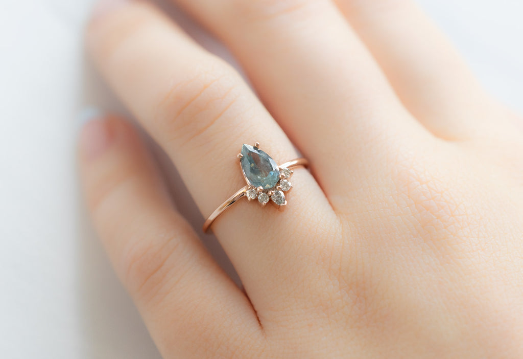 The Aster Ring with a Pear-Cut Montana Sapphire on Model