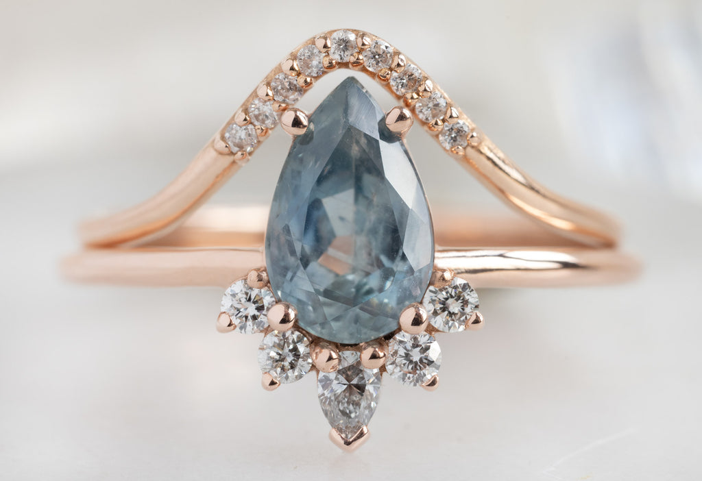 The Aster Ring with a Pear-Cut Montana Sapphire with Pavé Arc Stacking Band