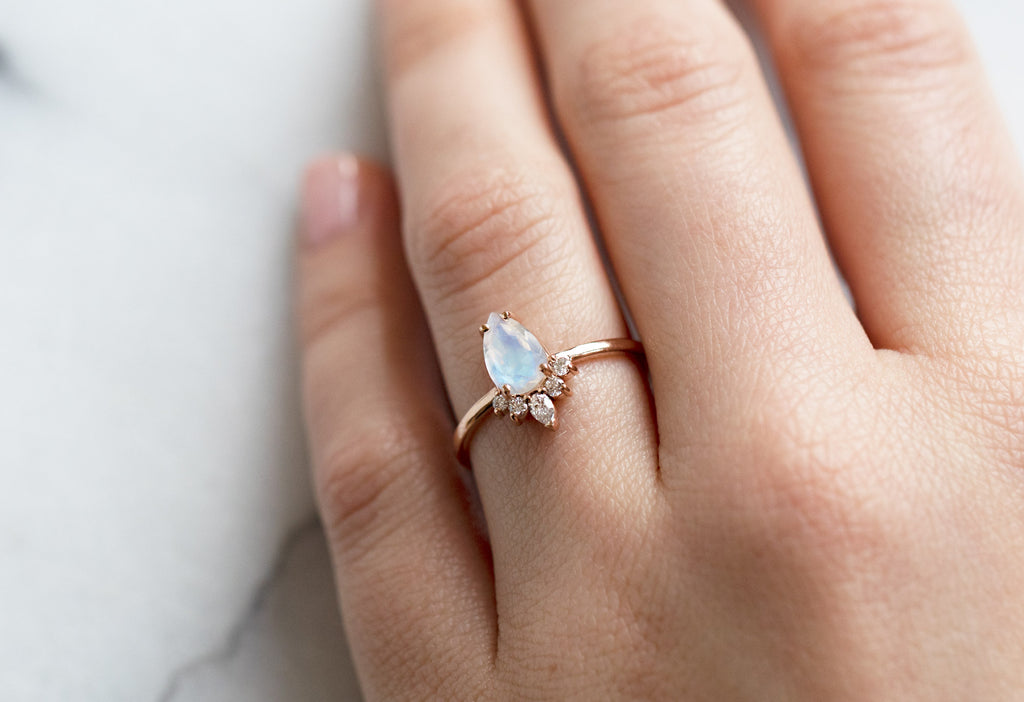 The Aster Ring with a Pear-Cut Moonstone on Model