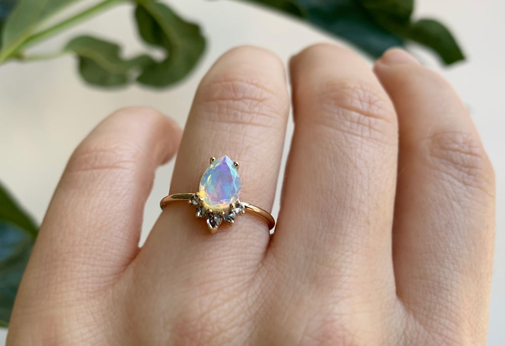 The Aster Ring with a Pear-Cut Opal on Model