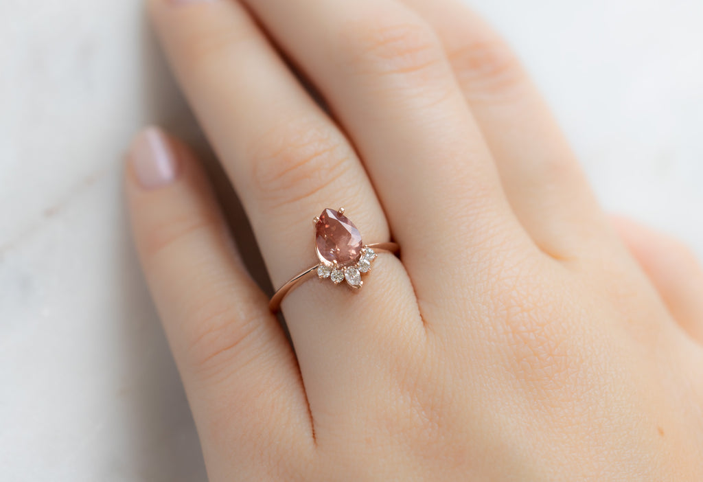 The Aster Ring with a Pear-Cut Sunstone on Model