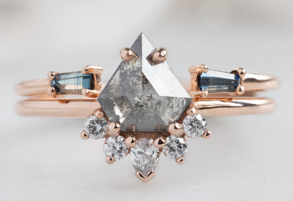 The Aster Ring with a Shield-Cut Salt and Pepper Diamond with Open Cuff Montana Sapphire Baguette Stacking Band