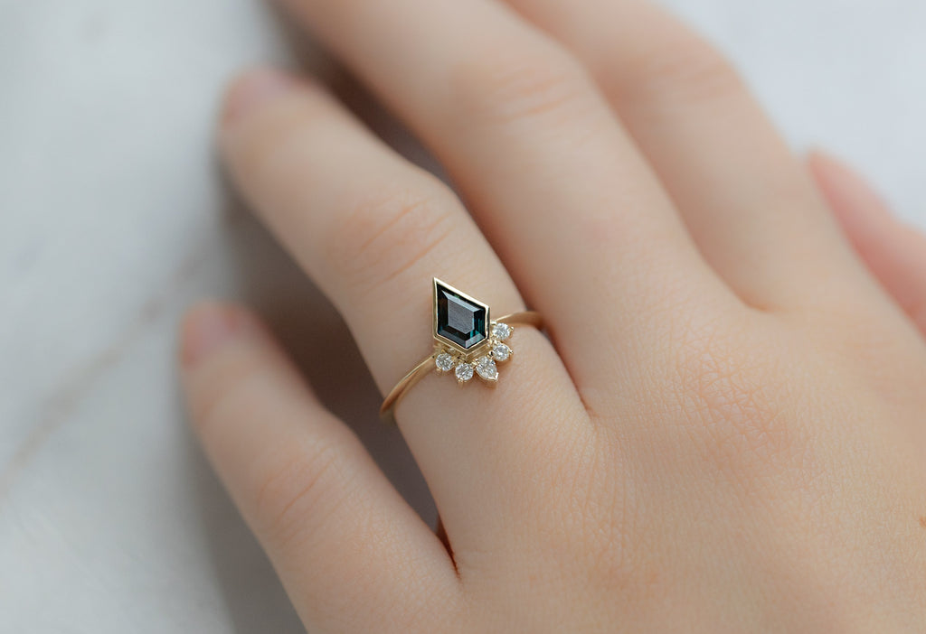 The Aster Ring with a Shield-Cut Sapphire on Model
