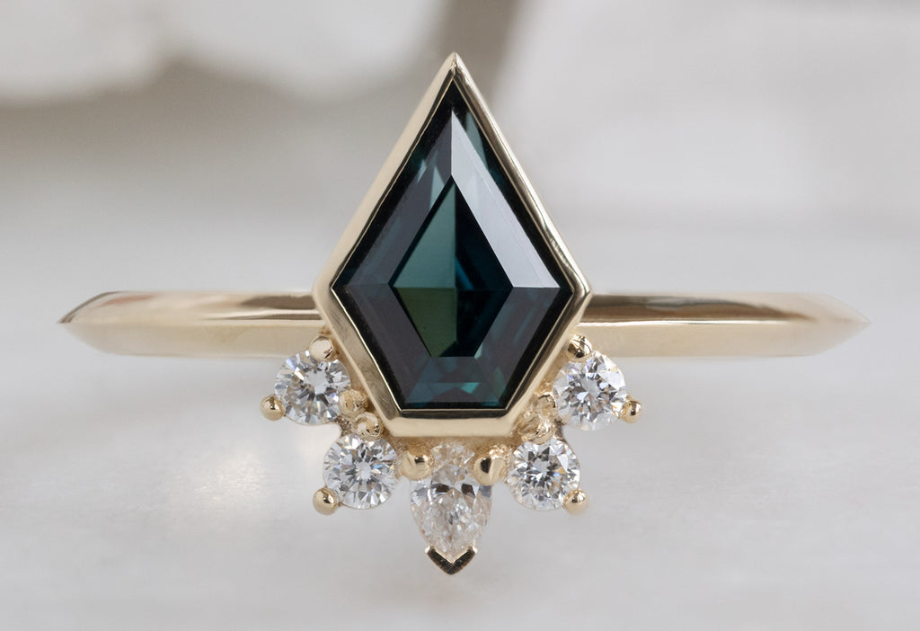 The Aster Ring with a Shield-Cut Sapphire