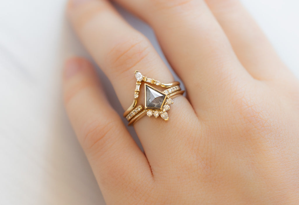 The Aster Ring with a Silvery Grey Kite-Shaped Diamond with White Diamond Stacking Bands on Model
