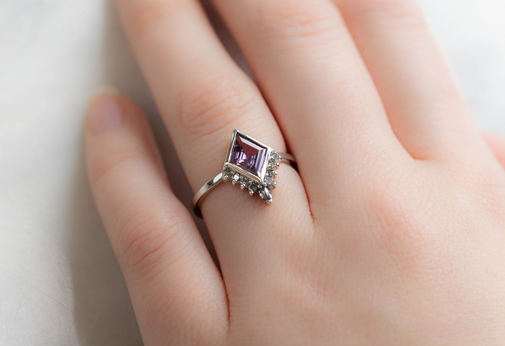 The Aster Ring with a Violet Kite-Shaped Sapphire on Model