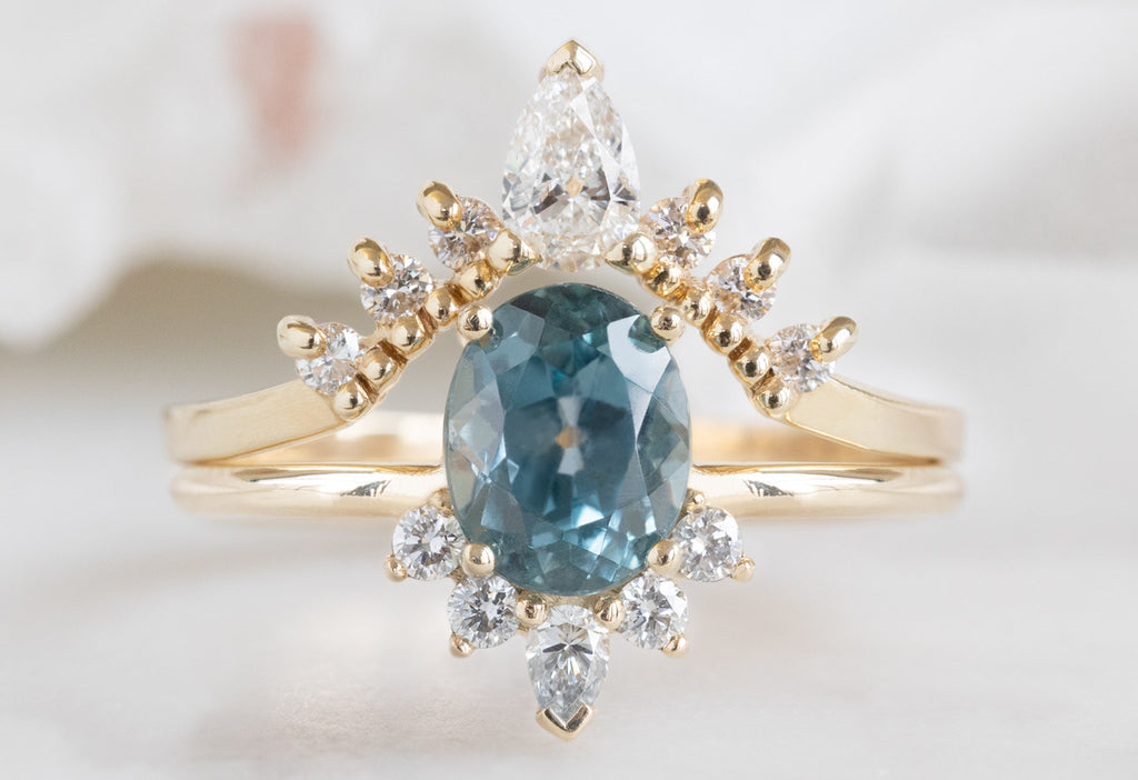 The Aster Ring with an Oval-Cut Montana Sapphire with White Diamond Sunburst Stacking Band