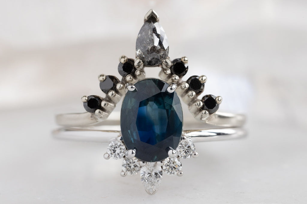 The Aster Ring with an Oval-Cut Sapphire with Black Diamond Wedding Band