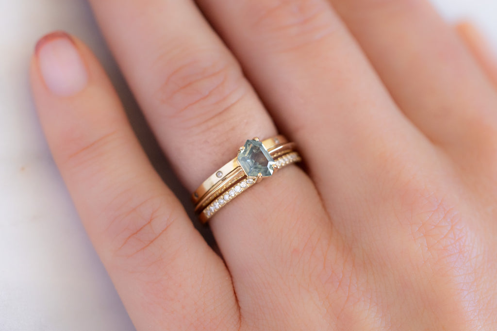 The Bryn Ring with a Geometric Montana Sapphire with Stacking Bands on Model