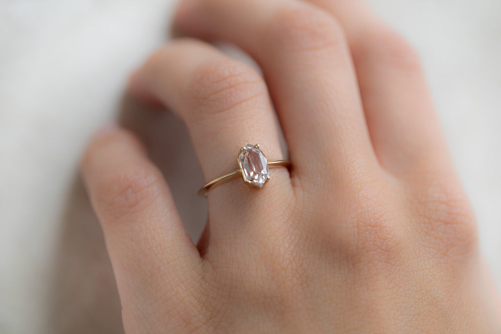 The Bryn Ring with a Hexagon Peach Sapphire On Model