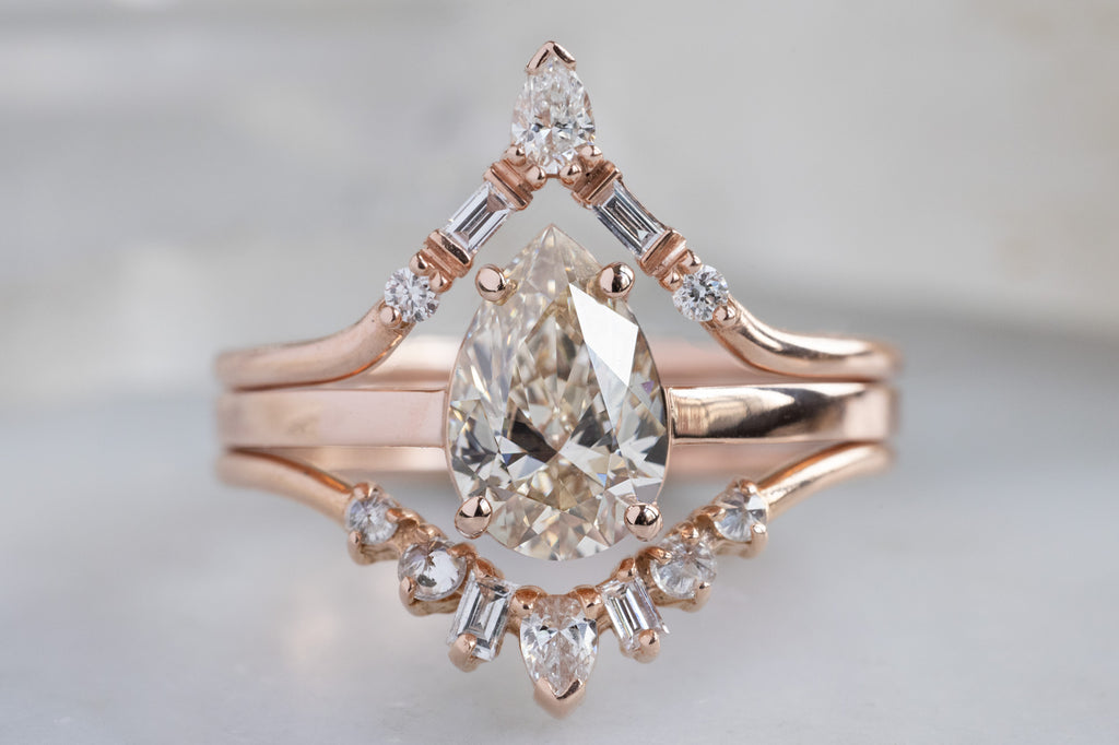 The Bryn Ring with a Pear Cut Champagne Diamond with Stacking Bands
