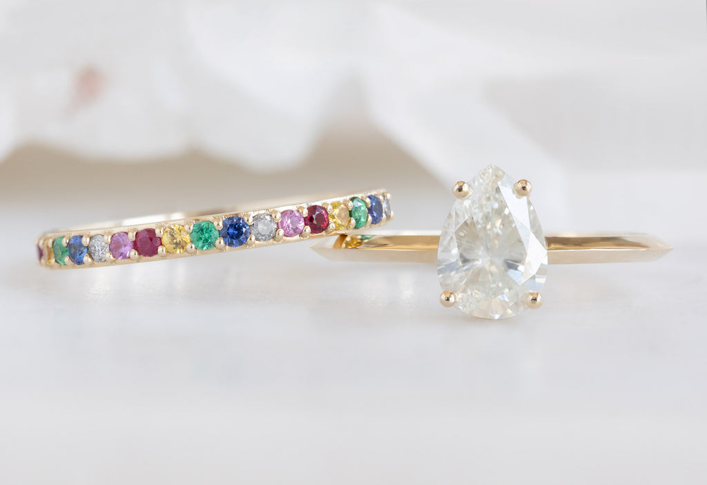 The Bryn Ring with a Pear-Cut White Diamond with Rainbow Sapphire Stacking Band
