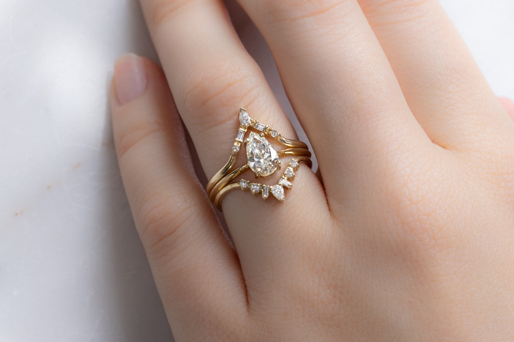 The Bryn Ring with a Pear-Cut White Diamond with Diamond Stacking Bands on Model