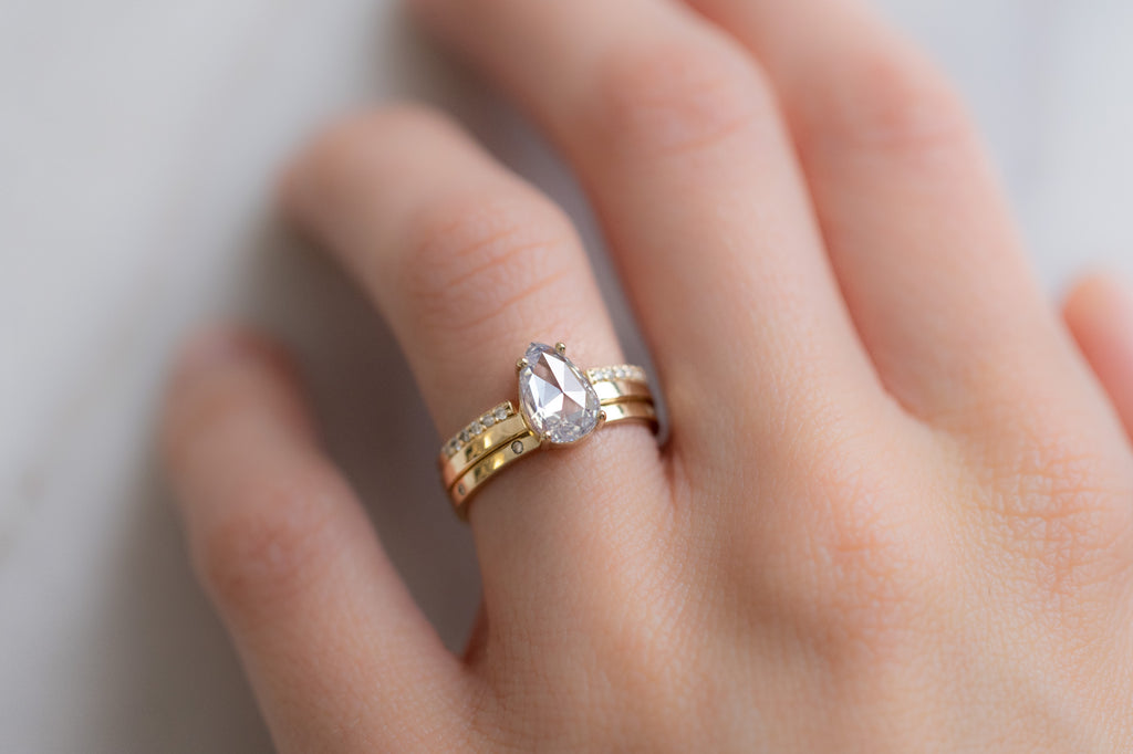 The Bryn Ring with a Rose-Cut White Diamond with Stacking Bands on Model