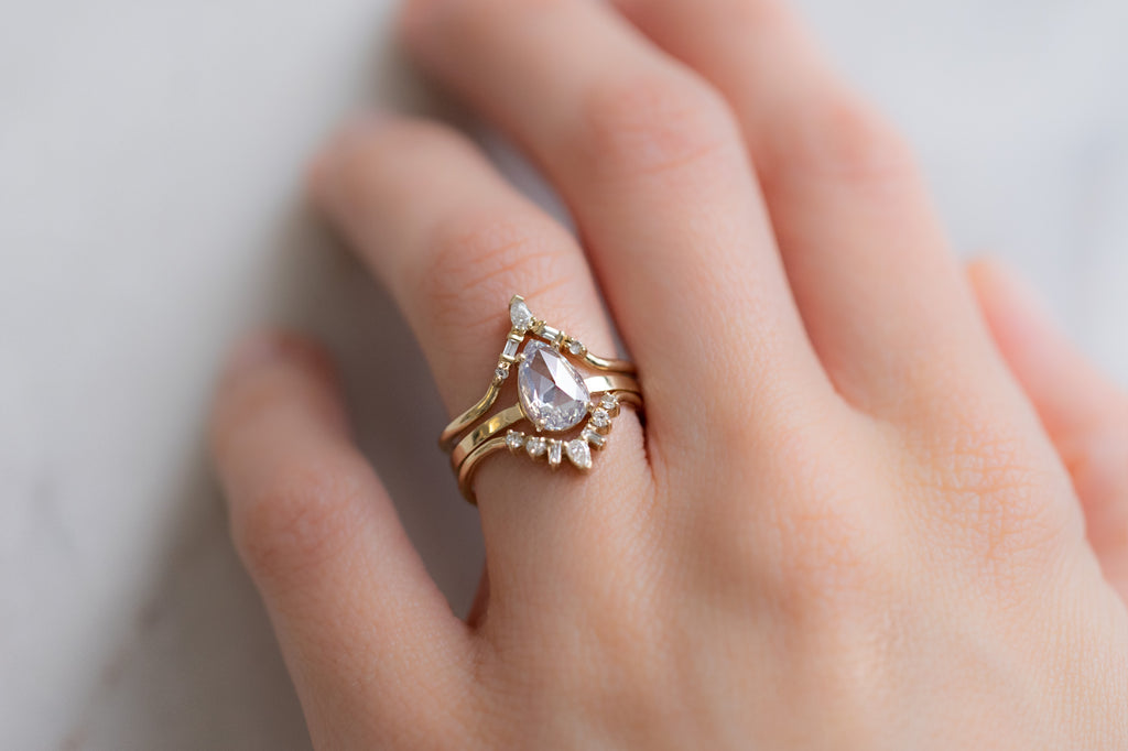 The Bryn Ring with a Rose-Cut White Diamond with Stacking Bands on Model