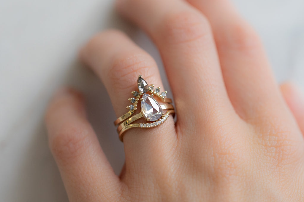 The Bryn Ring with a Rose-Cut White Diamond with Stacking Bands on Model