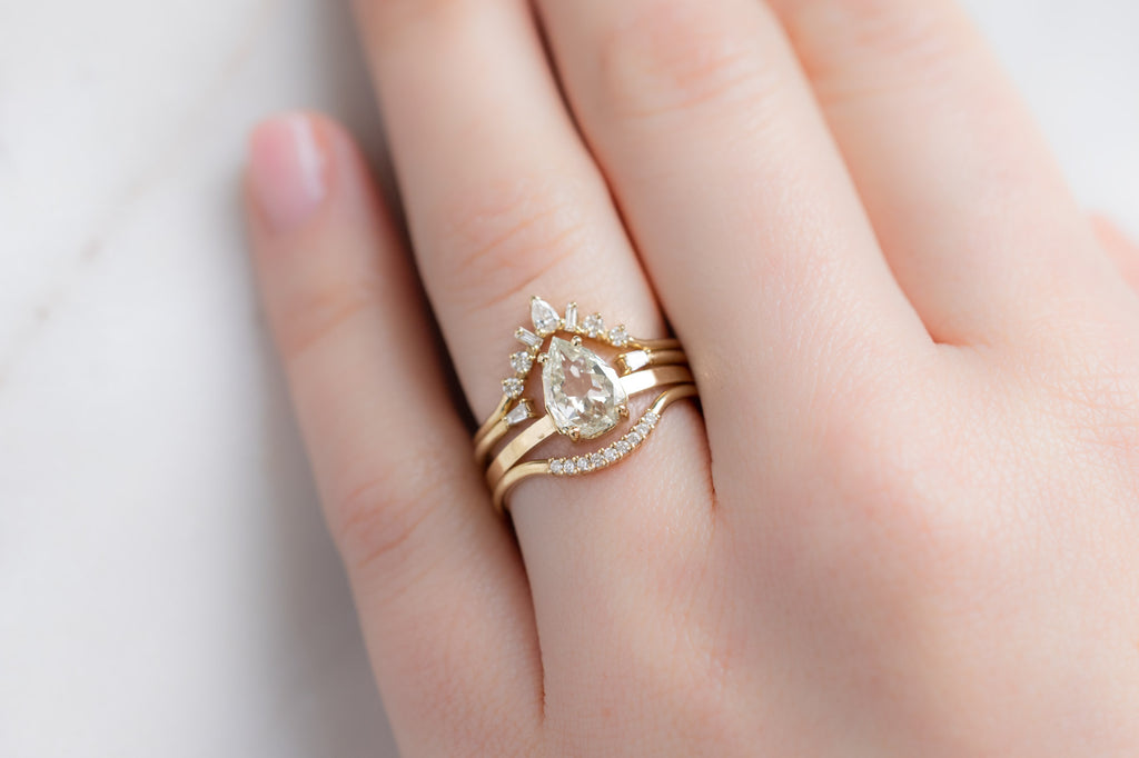 The Bryn Ring with an Artisan-Cut White Diamond with Stacking Bands on Model