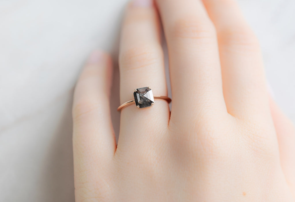 The Bryn Ring with an Emerald-Cut Black Diamond on Model