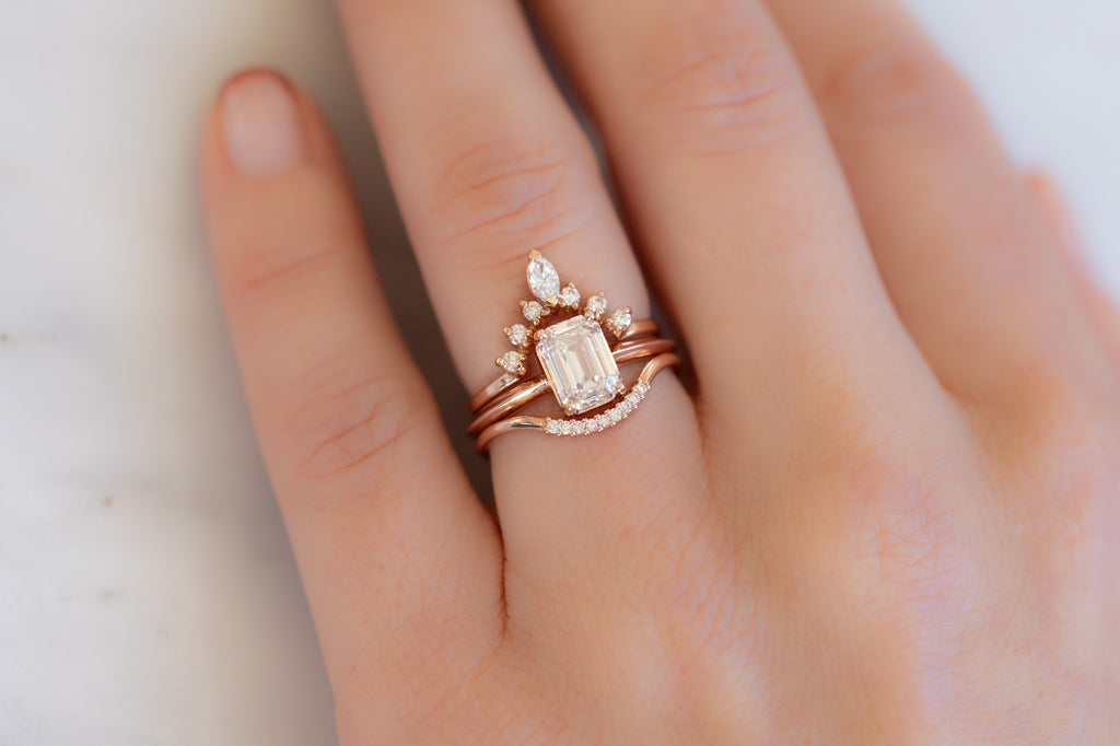 The Bryn Ring with an Emerald-Cut Pink Diamond with Stacking Bands on Model