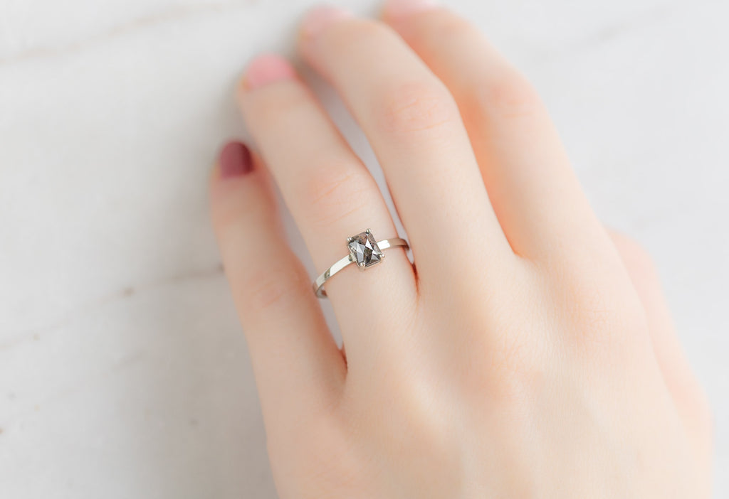 The Bryn Ring with an Emerald-Cut Black Diamond on Model