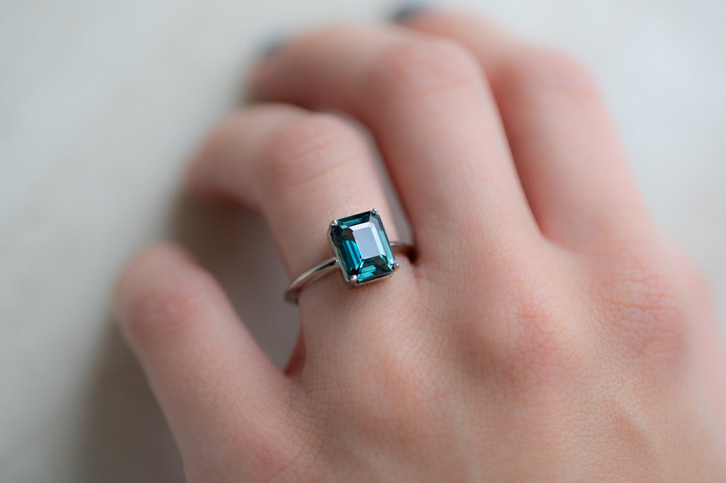 The Bryn Ring with an Emerald Cut Sapphire on Model