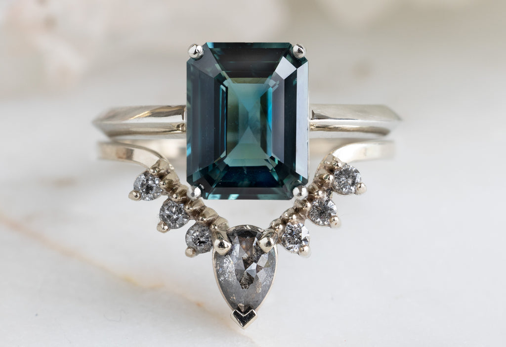 The Bryn Ring with an Emerald Cut Sapphire with Stacking Band