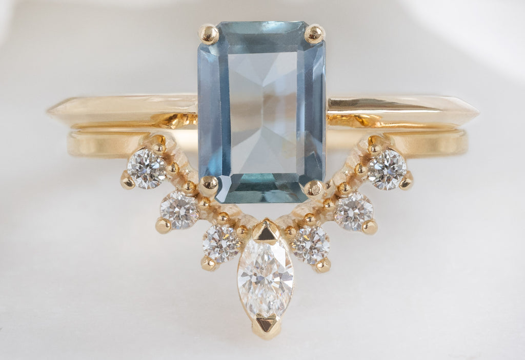 The Bryn Ring with an Emerald-Cut Sapphire with White Diamond Sunburst Stacking Band