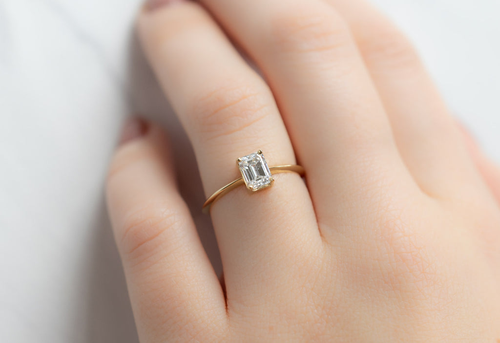 The Bryn Ring with an Emerald-Cut White Diamond on Model