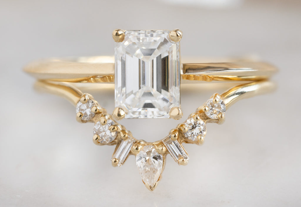 The Bryn Ring with an Emerald-Cut White Diamond with White Diamond Geometric Sunburst Stacking Band